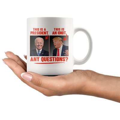 This (Biden) is a President, This (Trump) is an Idiot - Any Questions? (White Mug)